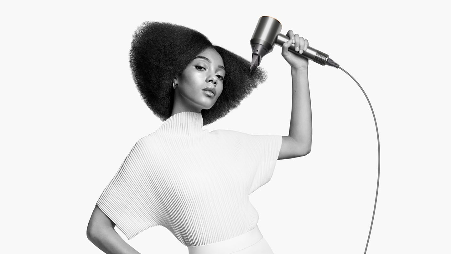 Model using Dyson Supersonic™ hair dryer 